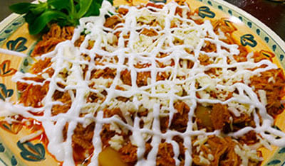 Tinga Poblana - Carne stufata e sfilettata con pomodoro e chipotle
